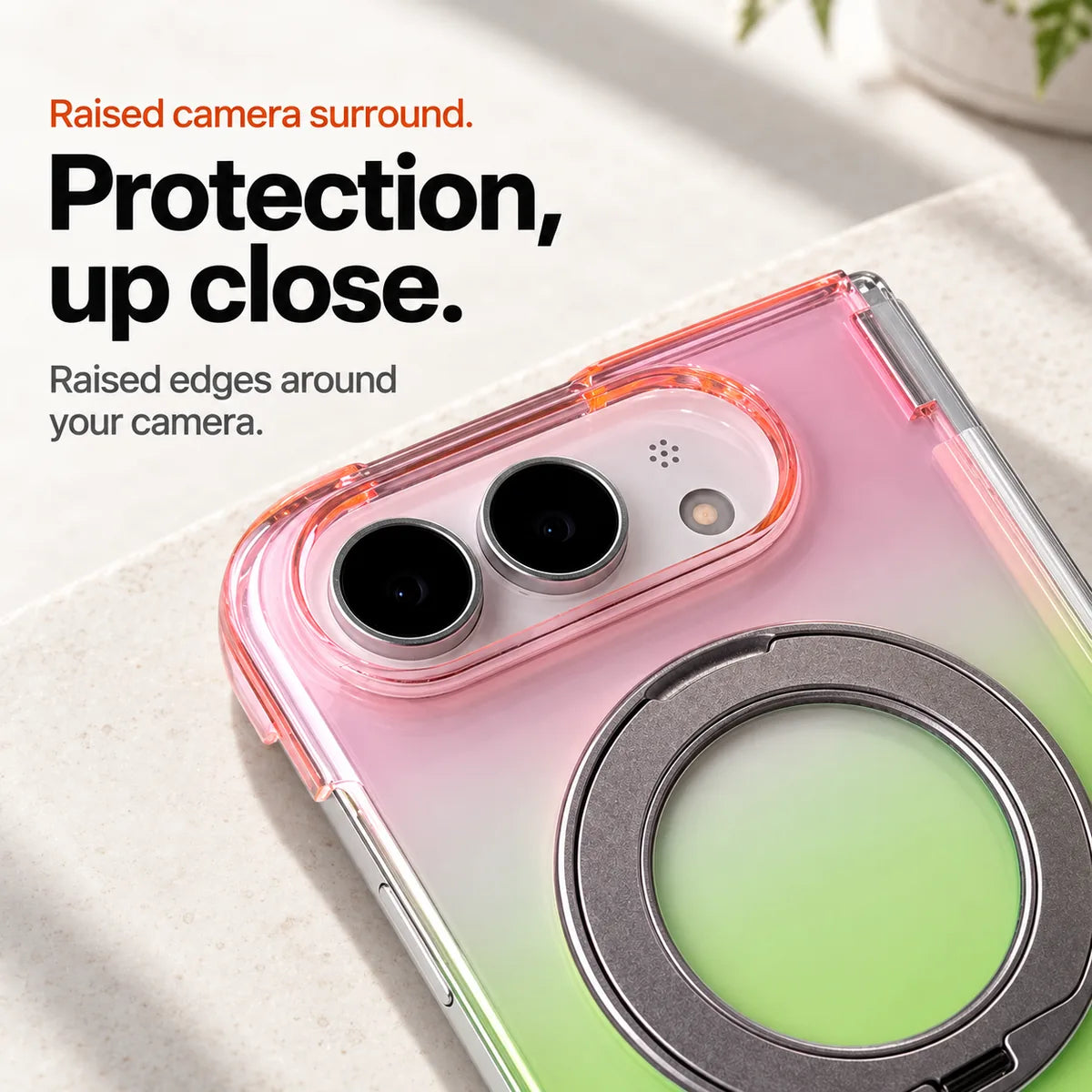 Pink and green gradient phone case close-up showing the raised oval camera surround and folded ring. #color_Aurora Bloom